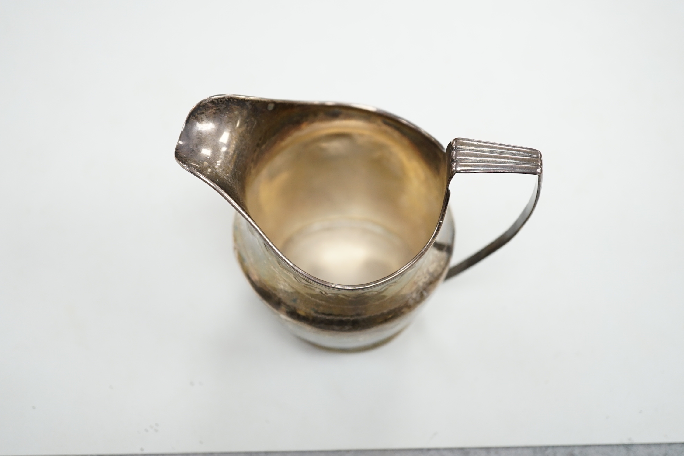 A George III engraved silver helmet shaped cream jug, London, 1801, 97mm, 3.3oz.